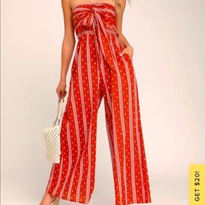 Red and white wide leg strapless Lulu’s women’s jumpsuit in medium.